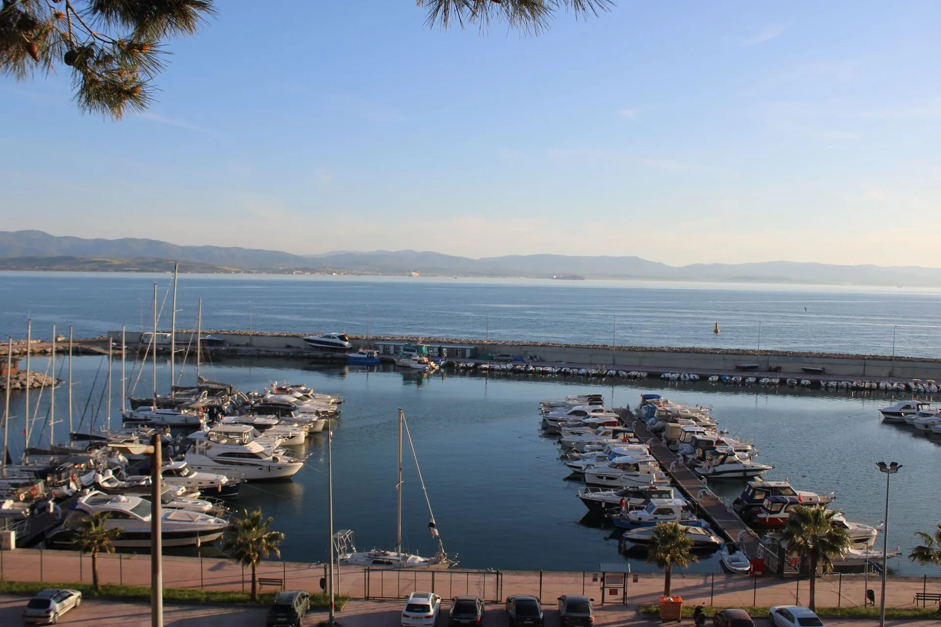 Boats docked at a marina at sunset in Barcelona, Spain