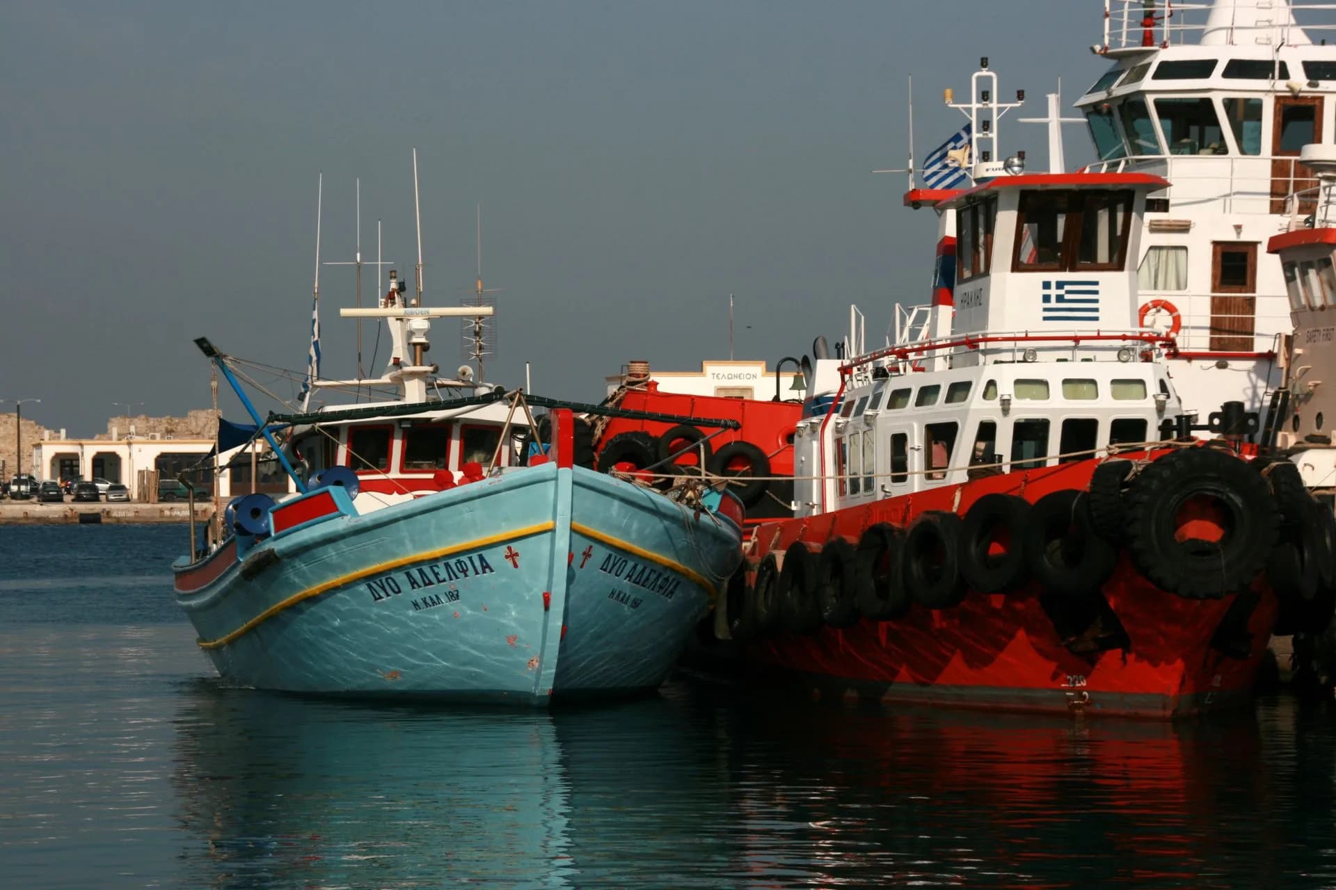 Colorful fishing boats docked at a Greek harbor