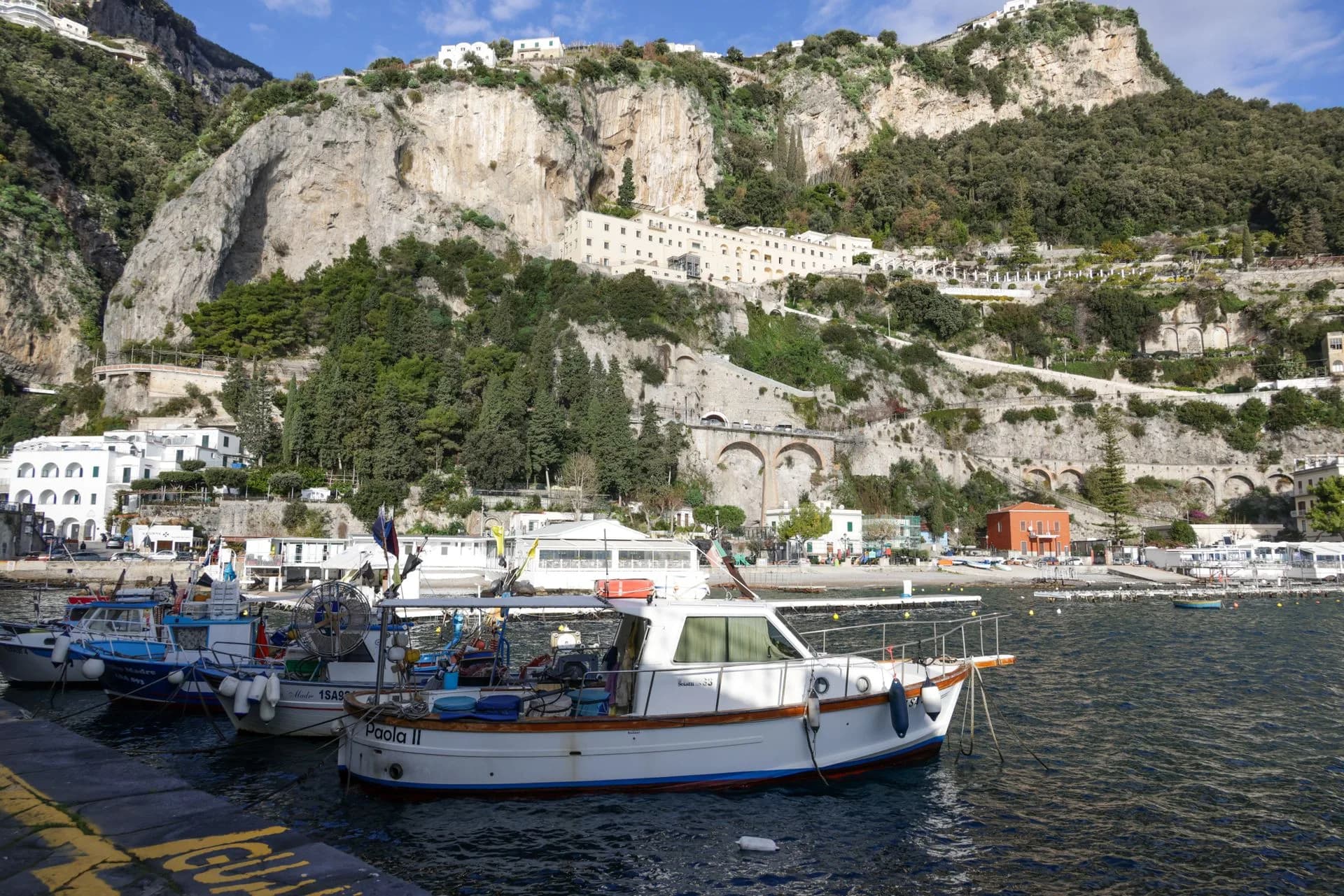 Boats and hillside buildings along the Amalfi coastline, Italy