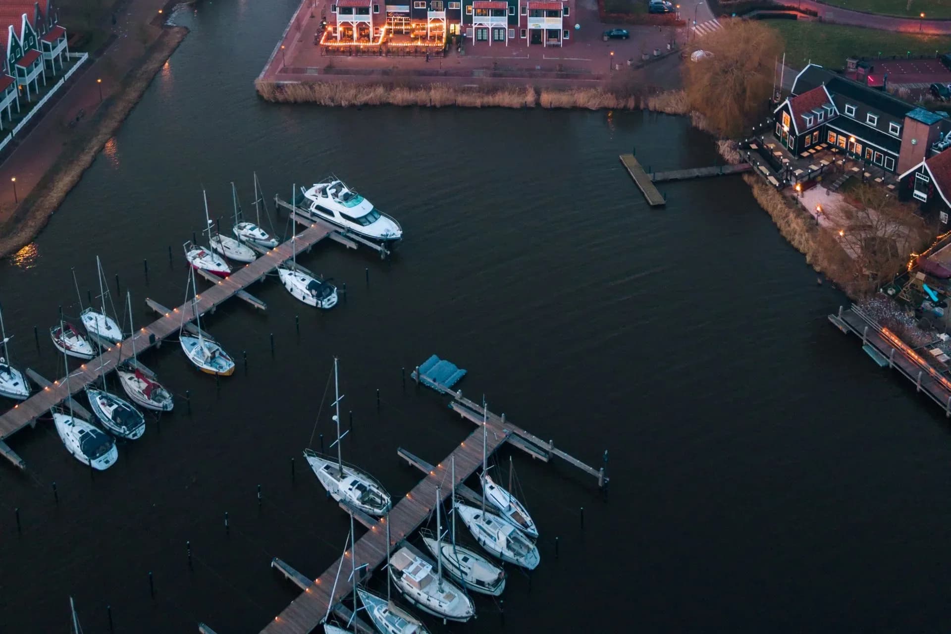 Aerial view of Volendam marina and waterfront homes at twilight, Netherlands