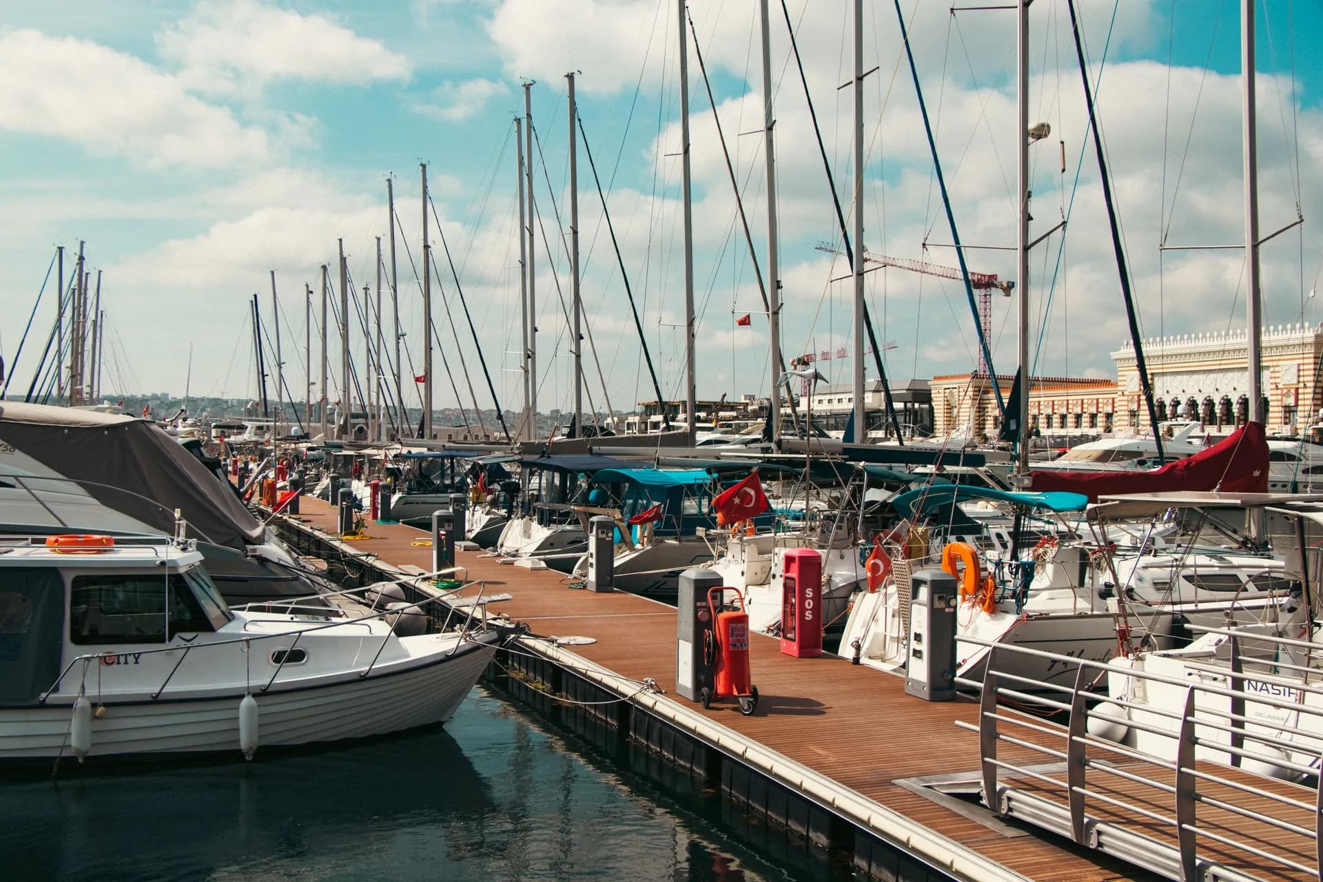 Yachts moored at an Istanbul marina beneath a blue sky, Türkiye