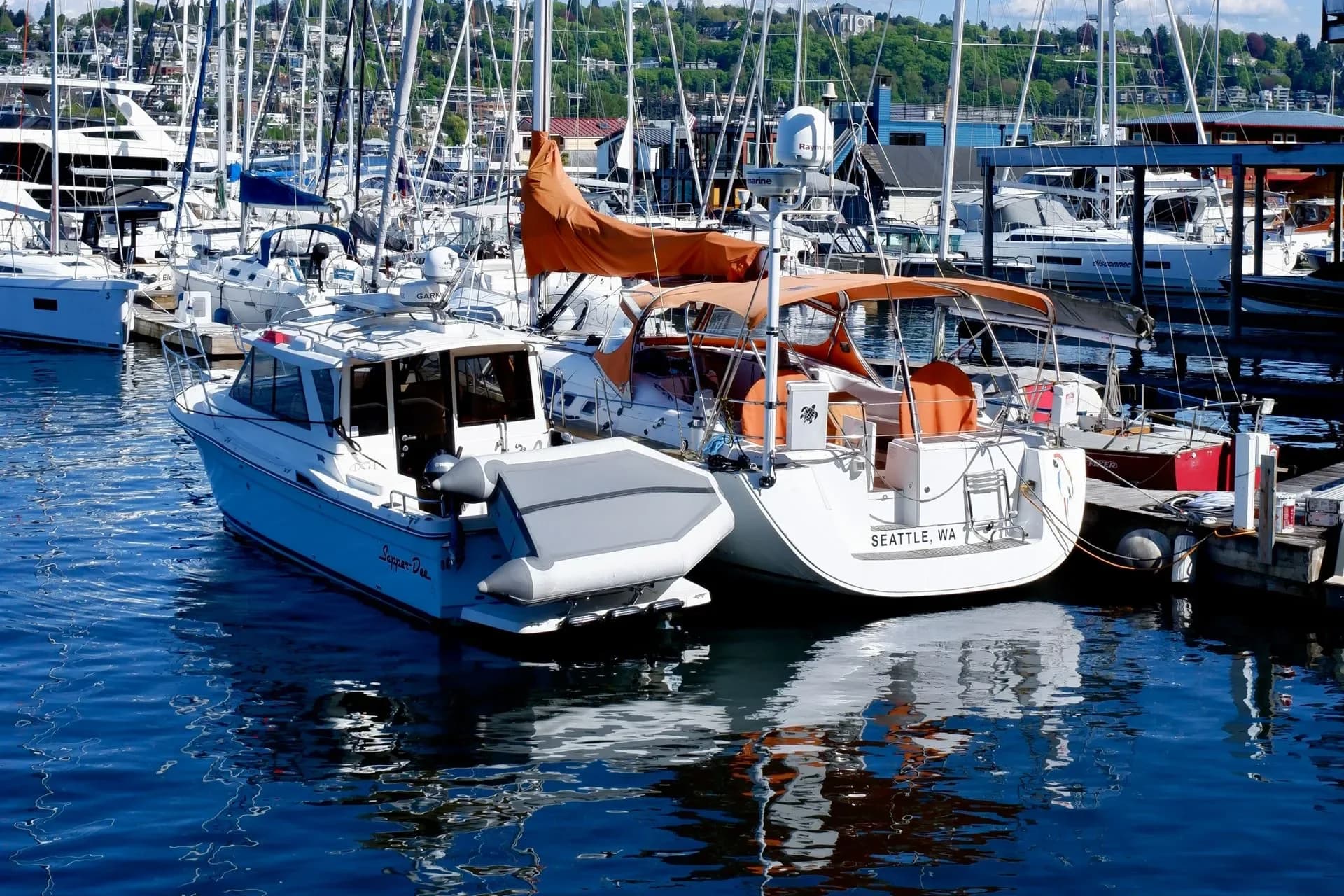 Boats moored beside a wooden pier in Seattle, Washington
