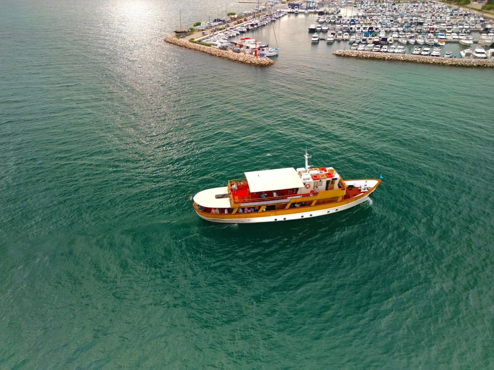 Boat cruising beside a marina in Zadar, Croatia