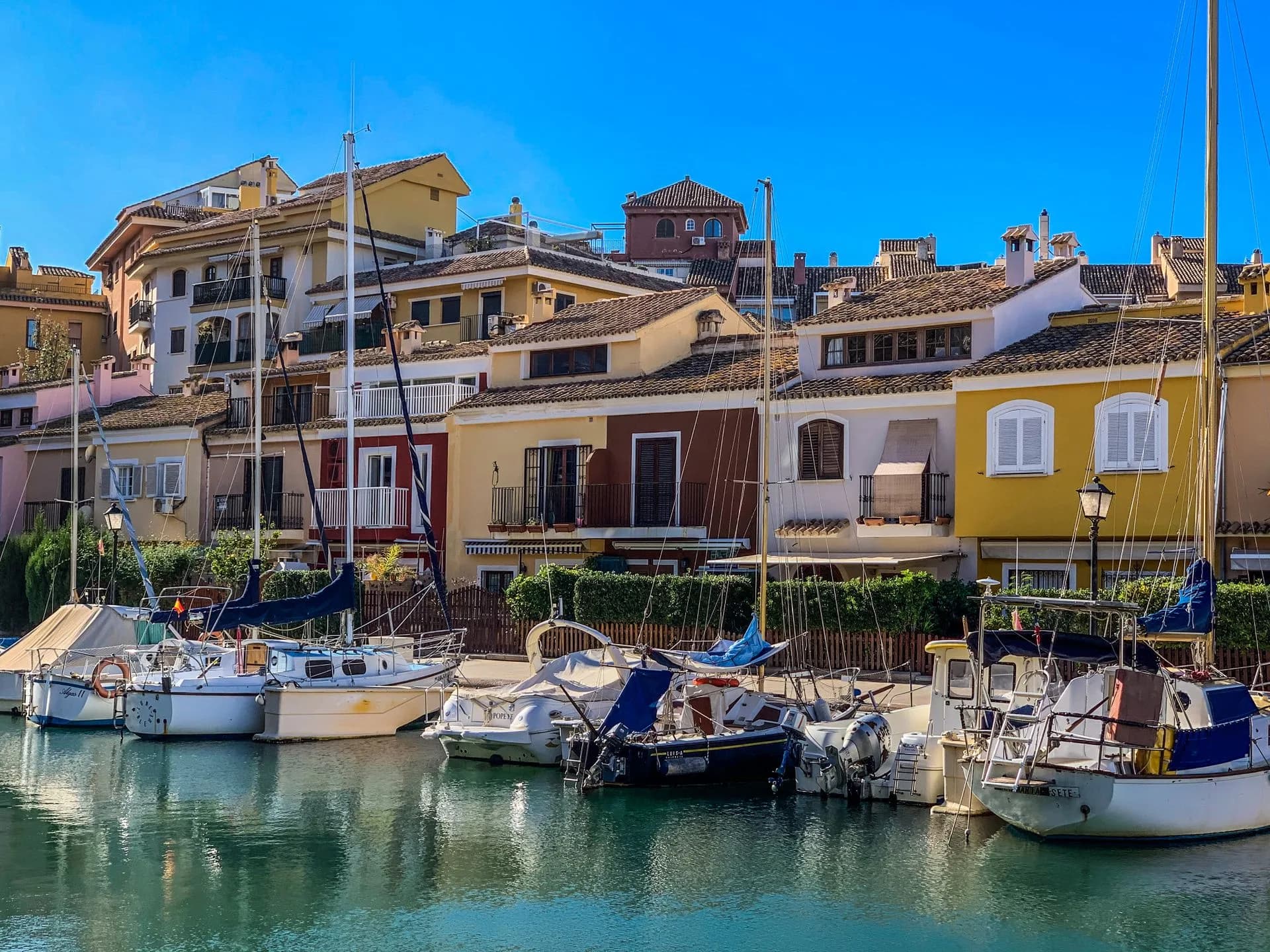 Sailboats and colorful waterfront buildings in Valencia, Spain