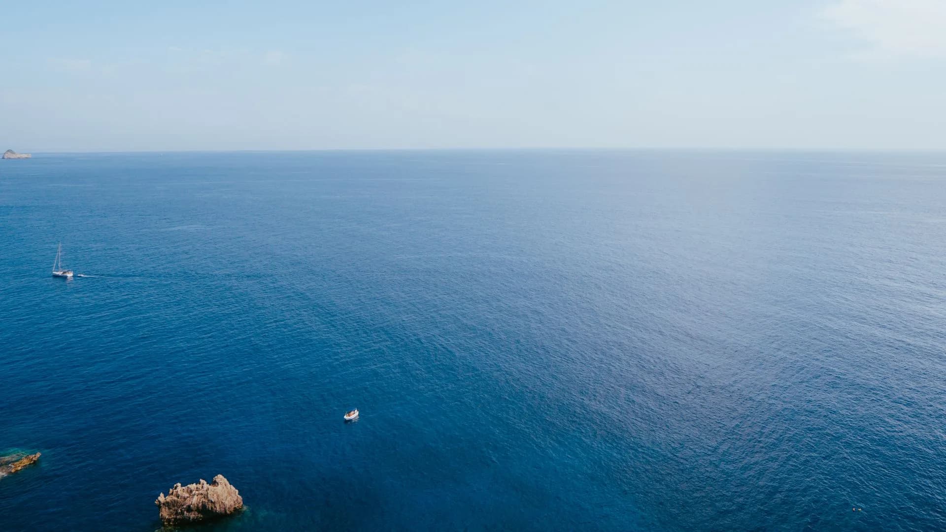 Boats on clear blue water near Corfu island, Greece