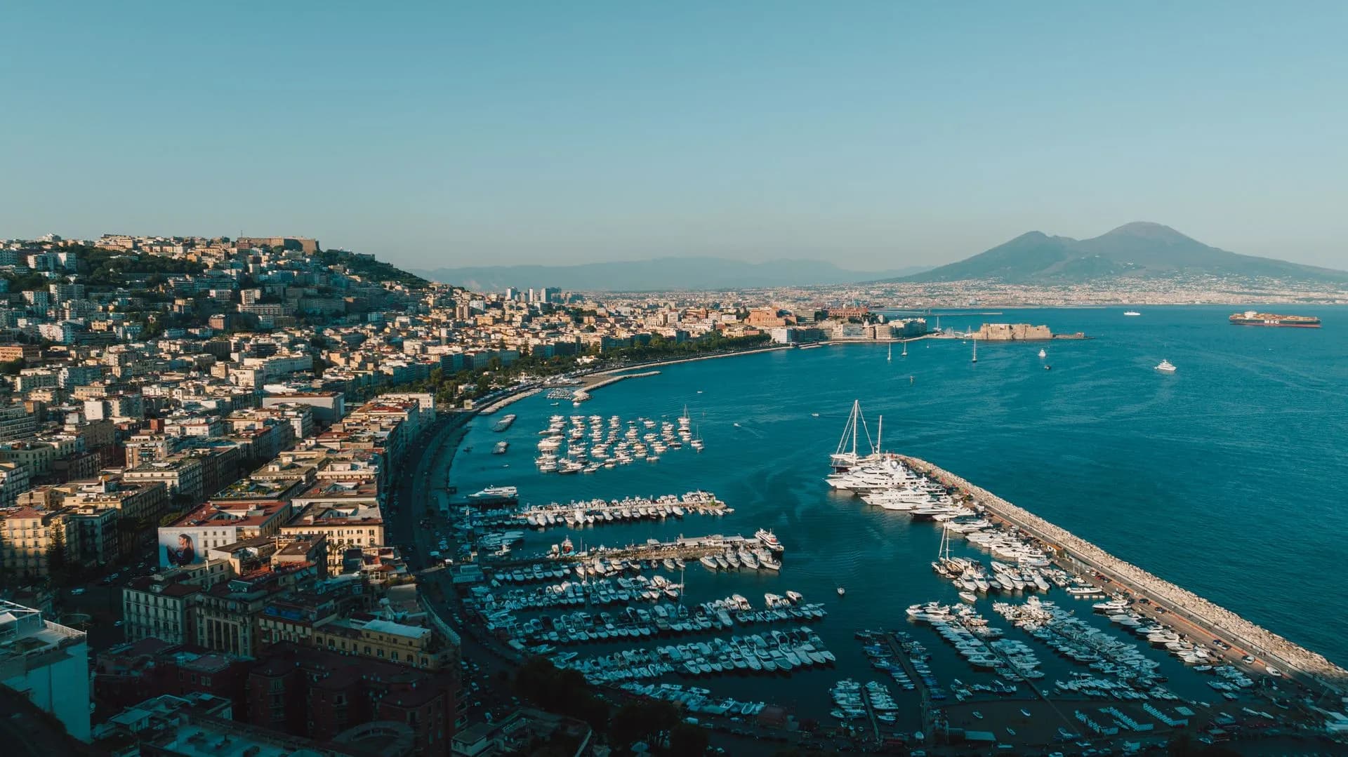 Aerial view of Naples harbor and the city skyline, Italy