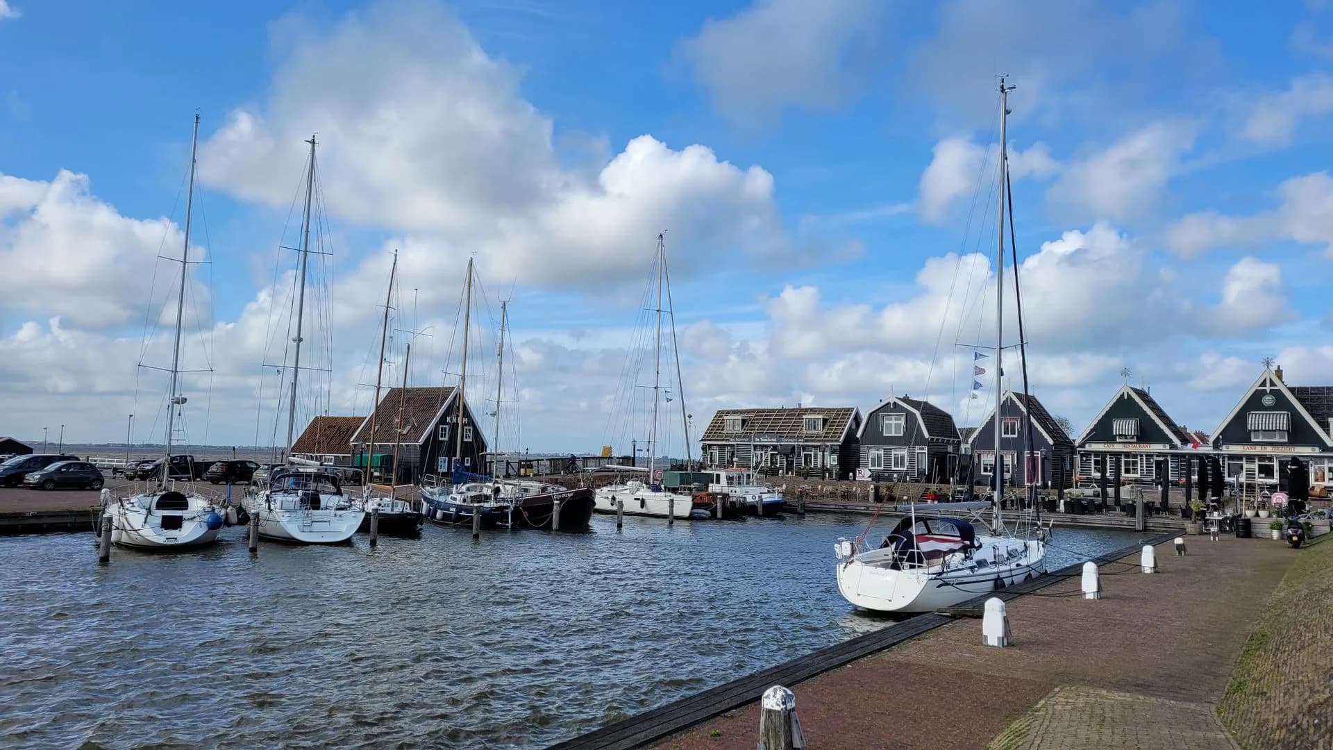 Sailboats and traditional waterfront houses in the Netherlands