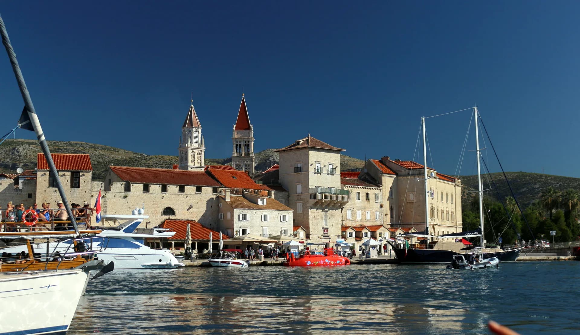 Historic Trogir waterfront and boats viewed from the water, Croatia