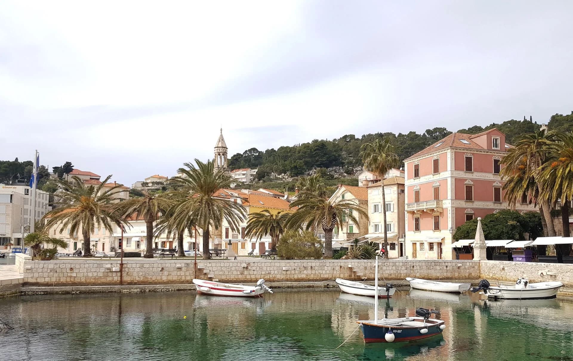 Harbor boats and historic waterfront buildings in Hvar, Croatia