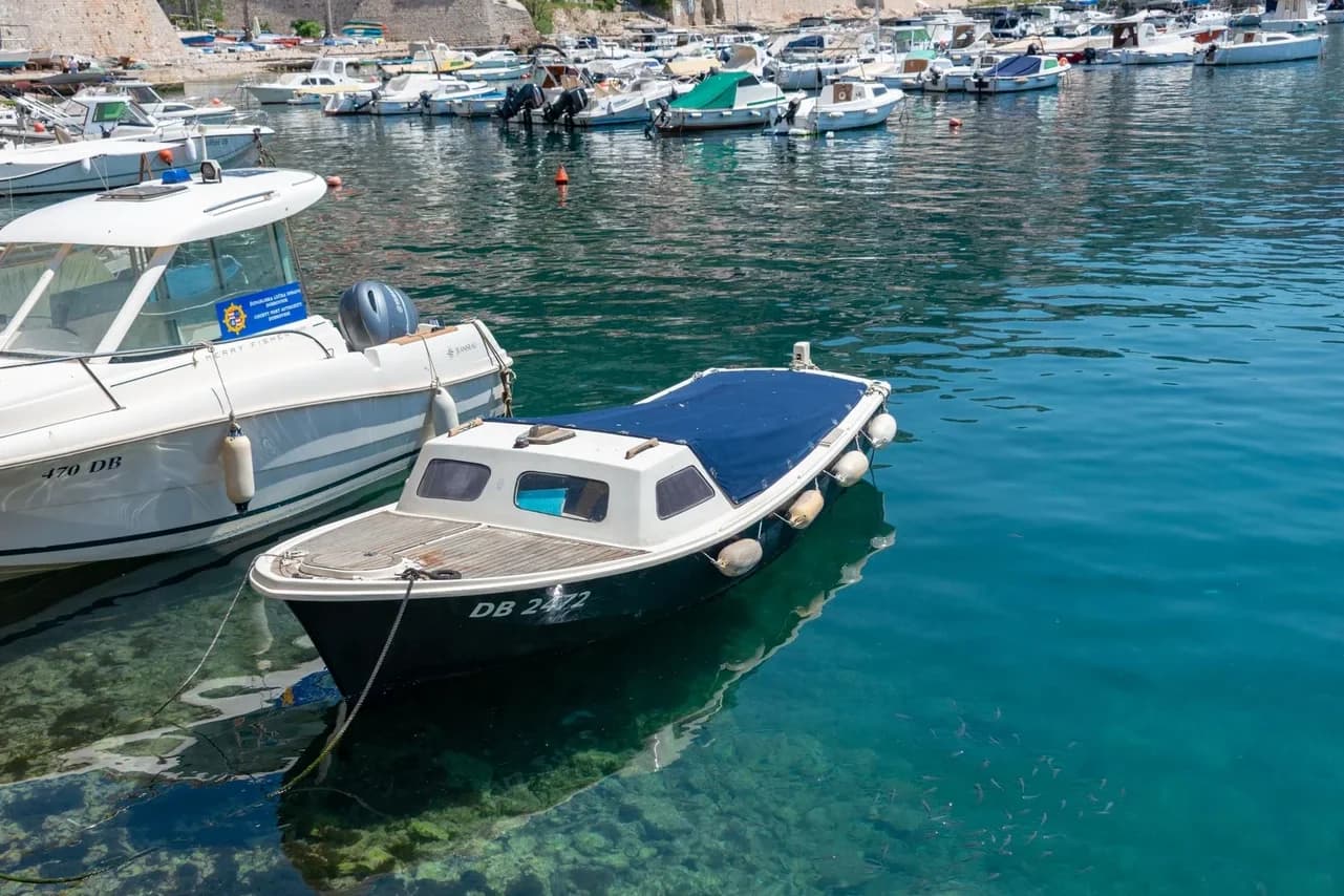 Small boats in the old harbor of Dubrovnik, Croatia