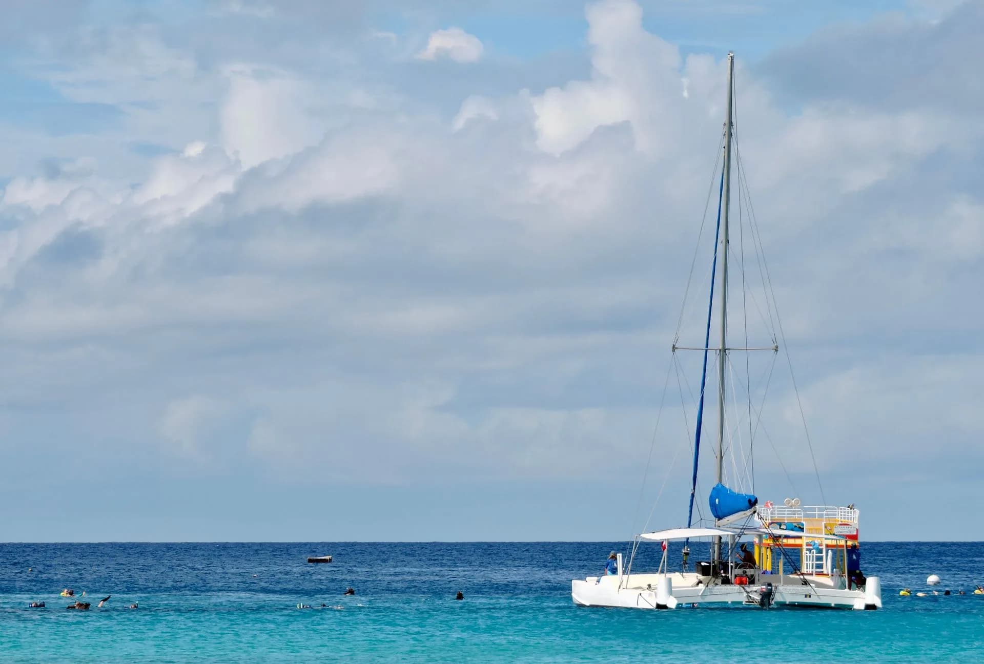 A catamaran on turquoise water in Barbados.